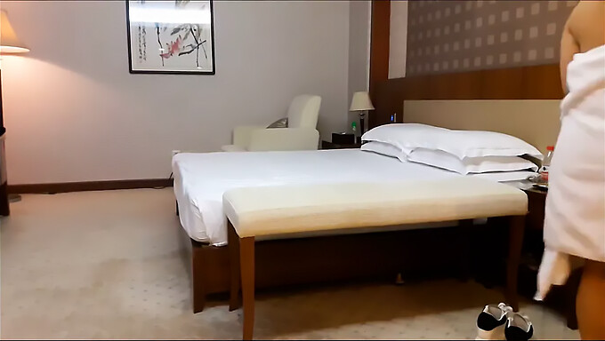 Asian escort gives a blowjob in hotel room